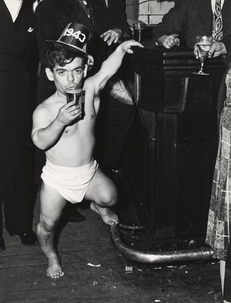 Shorty, the Bowery Cherub, New Year’s Eve at Sammy’s Bar, 1943. Pic by Weegee © International Center of Photography