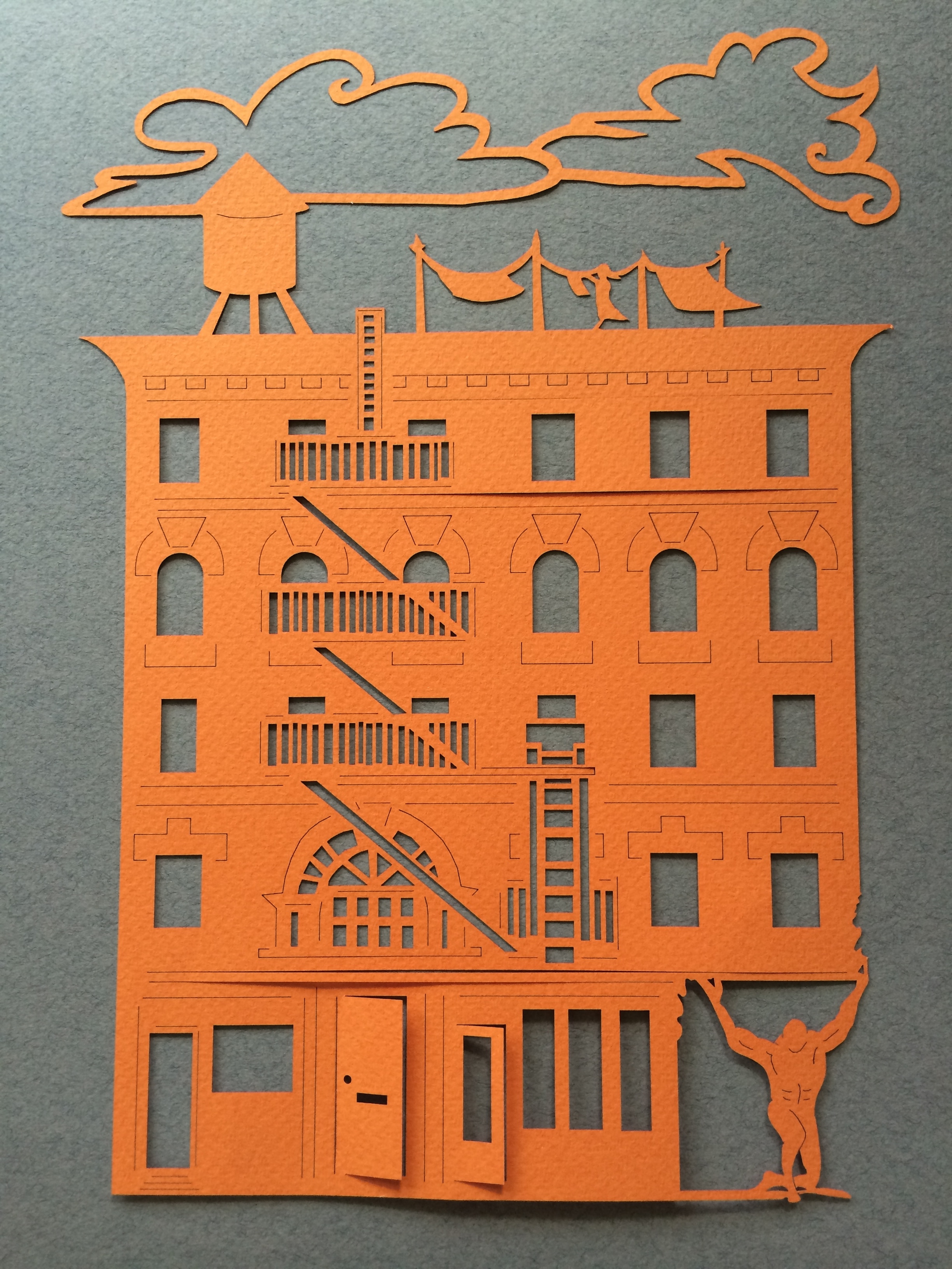 WINDOW PAIN...Atlas strains to hold up building in this laser-cut