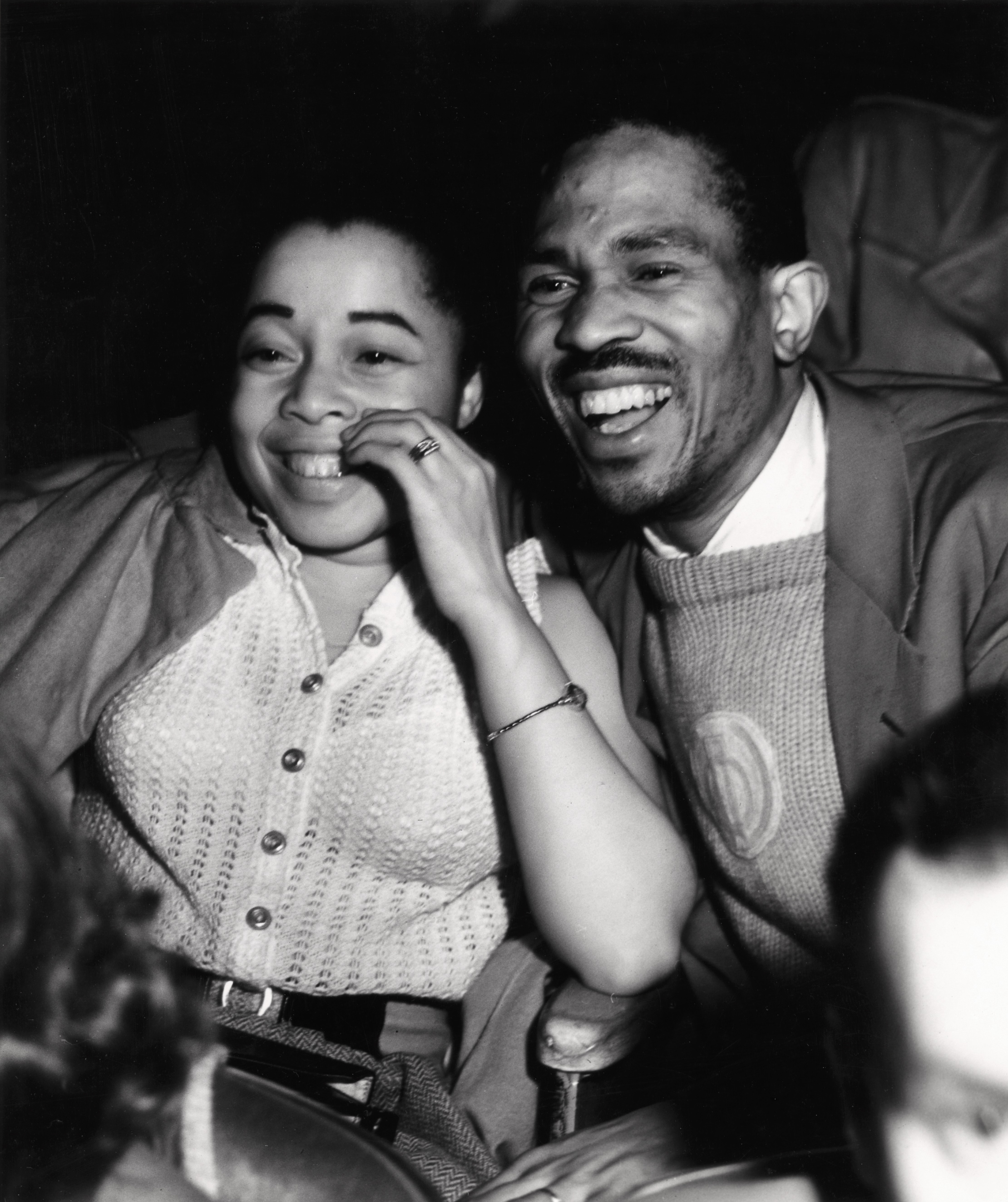 GIGGLES: Woman and man laughing  © Weegee/ International Center of Photography.