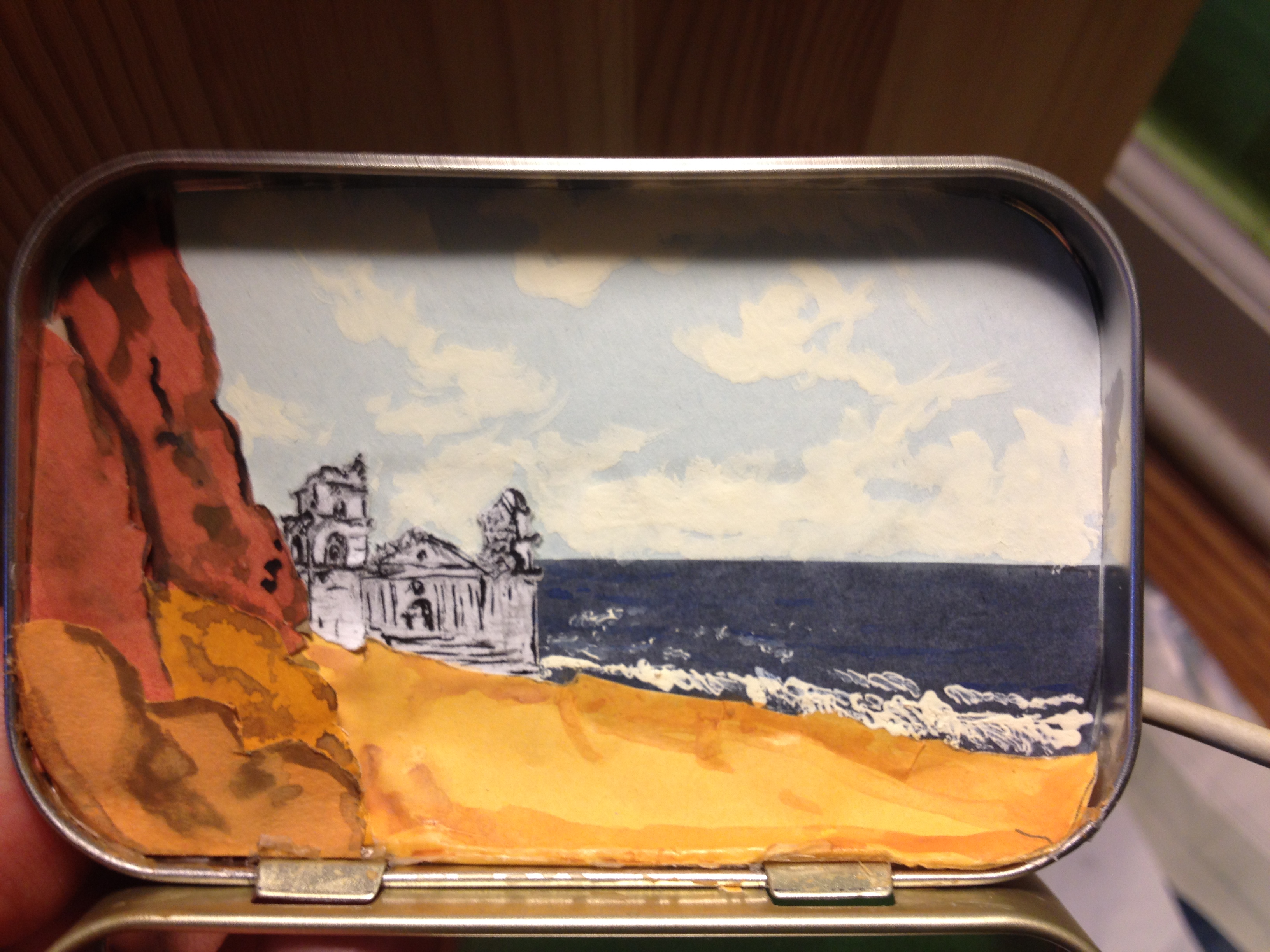 MYSTERIOUS...a palace is lapped by waves on a rocky coast in this dream box