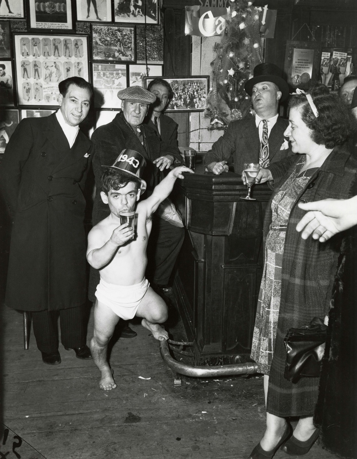 Shorty, the Bowery Cherub, New Year's Eve at Sammy's Bar, New York, 1943, © Weegee / ICP